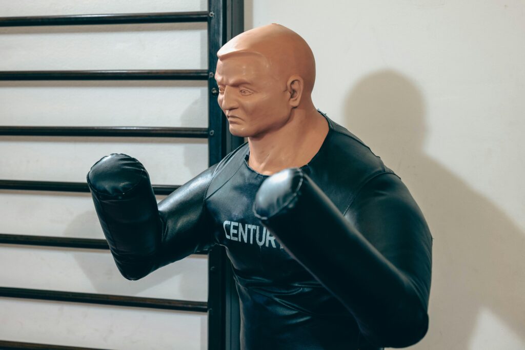 pexels photo 14856105 14856105 Realistic boxing dummy used for martial arts training in a gym.