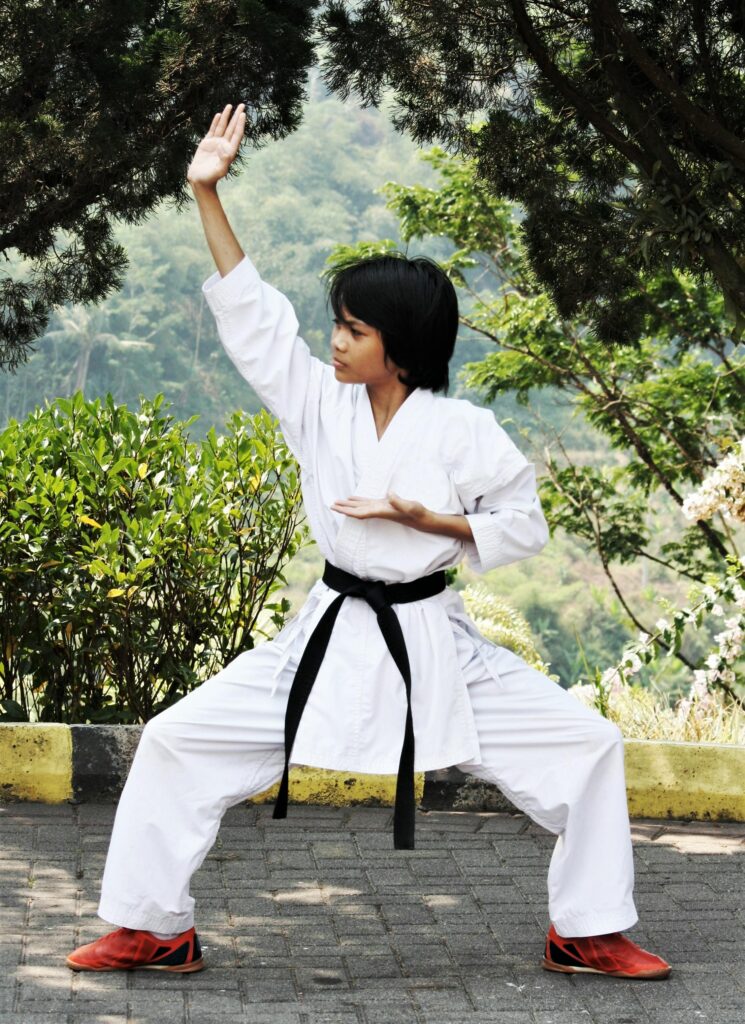 pexels photo 9324671 9324671 A young boy practicing karate in traditional kimono outdoors, symbolizing discipline.
